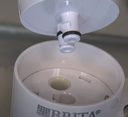 insert the filter cartridge into the filter cup of the brita water filter